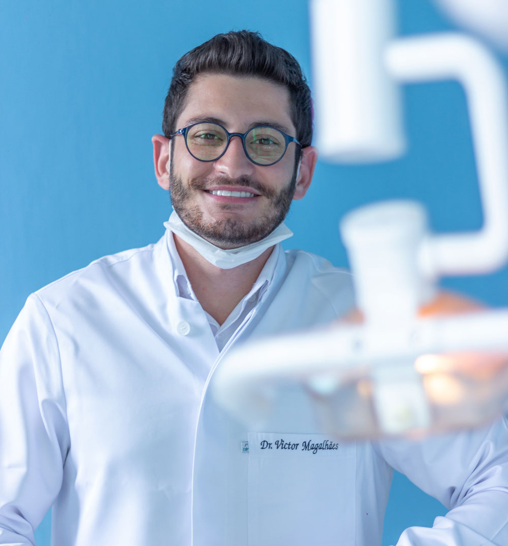 Portrait of a smiling dentist in the treatment room
