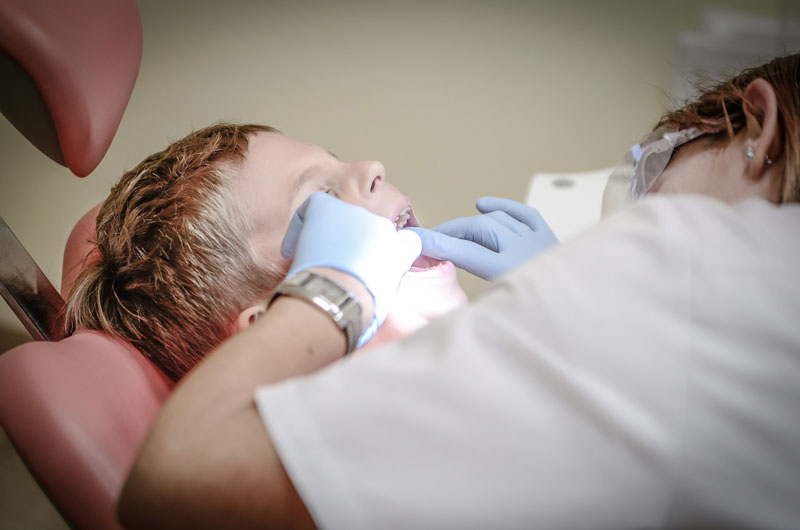 Young patient receiving a gentle dental check-up